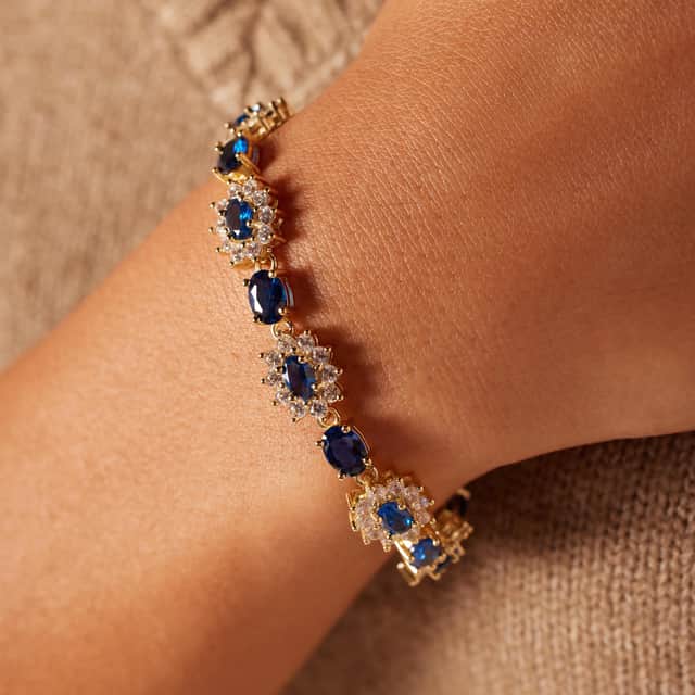 Zilveren goldplated armband met zirkonia blauw/wit