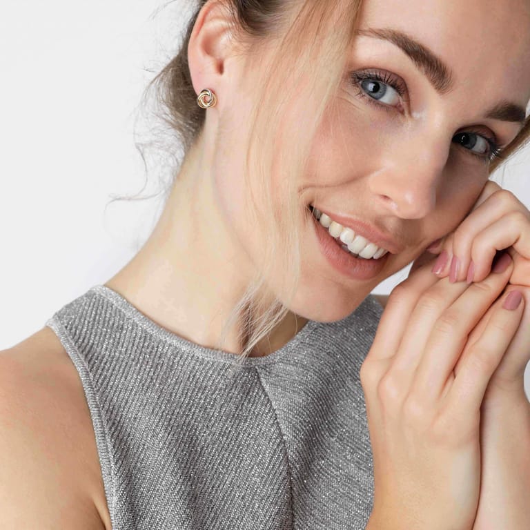 9 karaat oorknoppen swirl bicolor voor dames