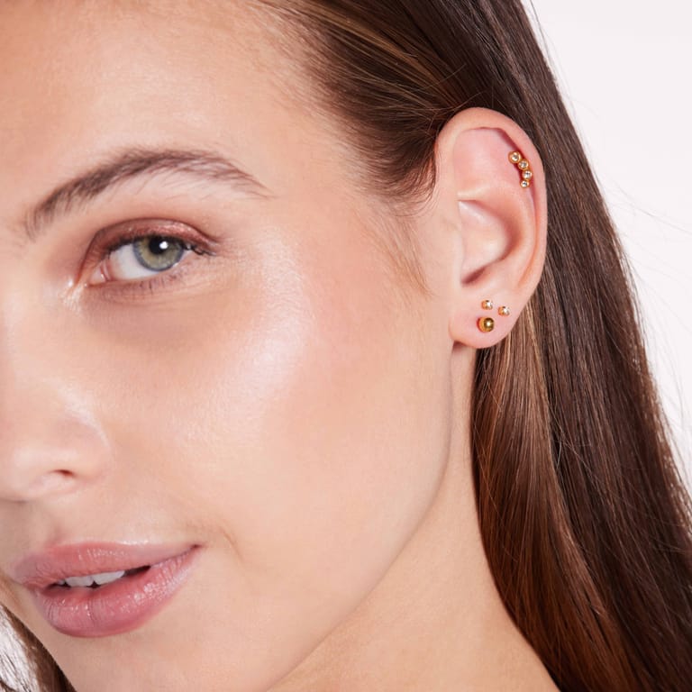 Stainless steel goldplated helixpiercing met kristal voor dames