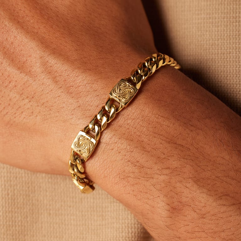 Stalen goldplated herenschakelarmband surinaamse mattenklopper