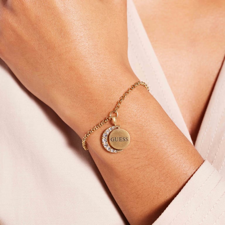 Guess stainless steel goldplated schakelarmband met kristal voor dames