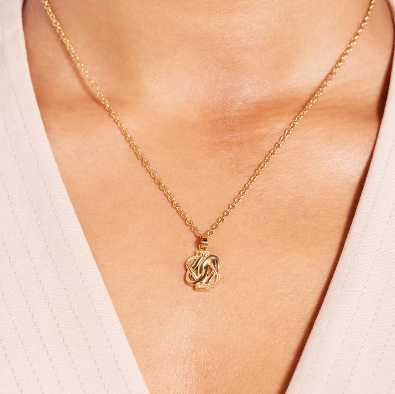 Stalen goldplated ketting met hanger surinaamse mattenklopper