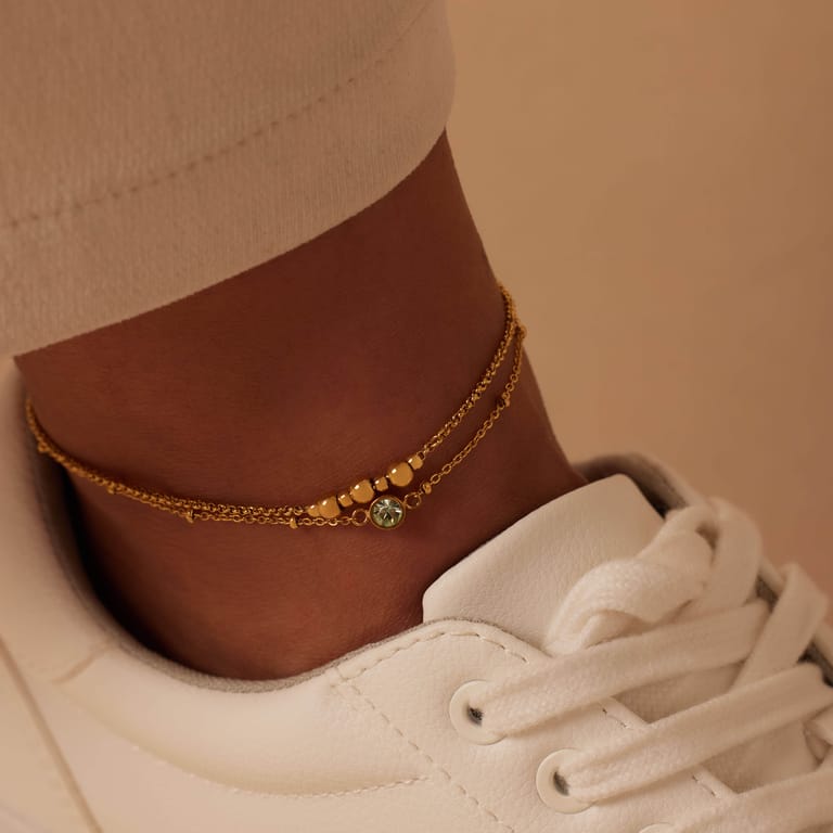 Dubbele goldplated stalen enkelbandje met steentje