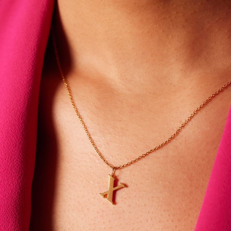 Stainless steel goldplated ketting met letterhanger X voor dames