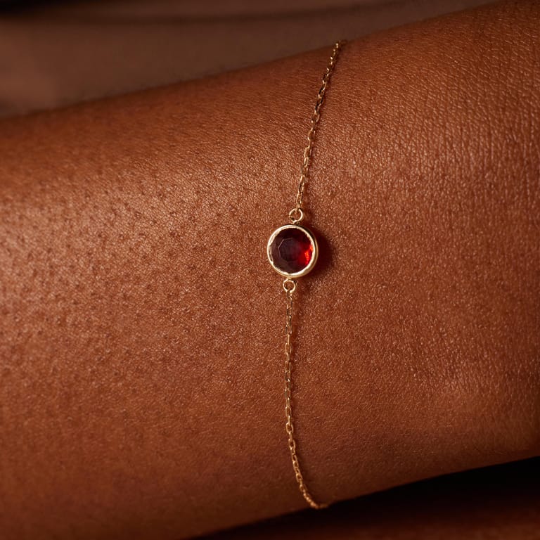 Armband aus 585 Gelbgold mit Geburtsstein-Anhänger, Januar