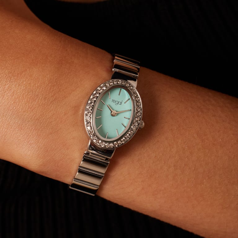 Regal Armbanduhr, blaues, mit Zirkoniasteinen besetztes Zifferblatt.