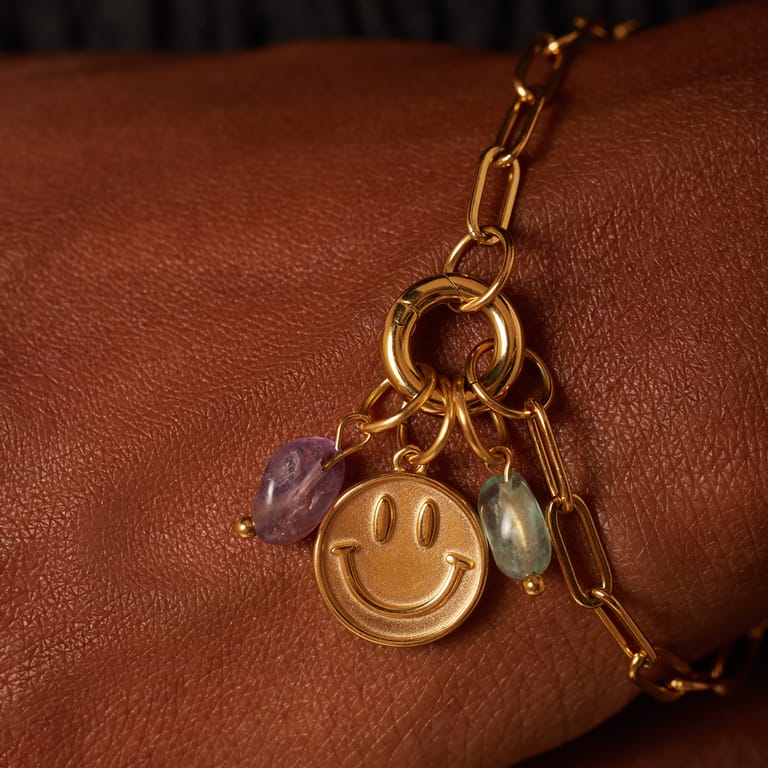 Stalen goldplated bedel met blue sand steen