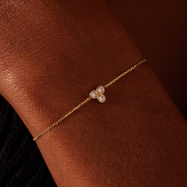 14 karaat gouden armband 3 zirkonia steentjes